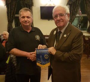President John Rathbone presented with a pennant from our District Governor, David McDowell