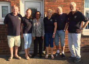 Maltby and Rother Valley Lions install a security light for Carol Gott