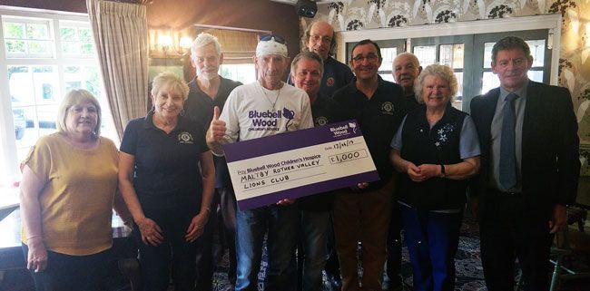 Maltby and Rother Valley Lions Club prent cheque to Harry for Bluebell Wood Children's Hospice